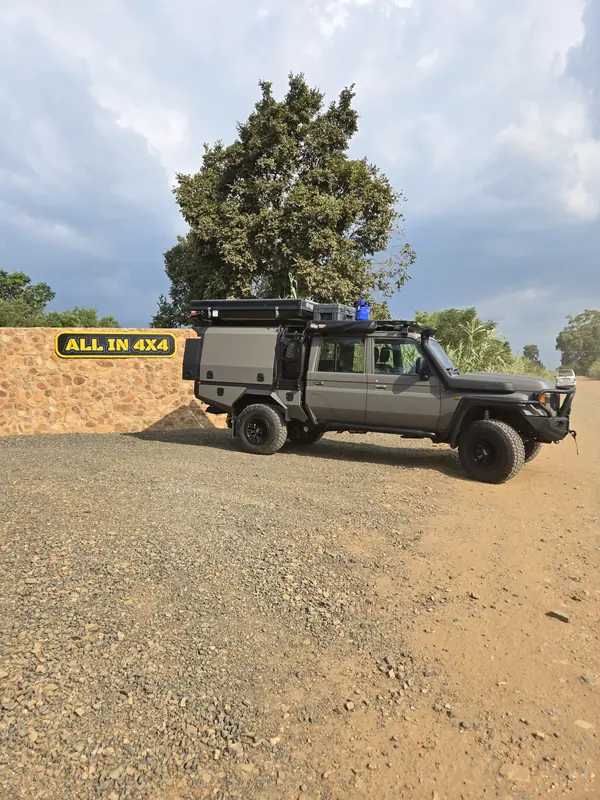 Land Cruiser 79 with canopy on a dirt track
