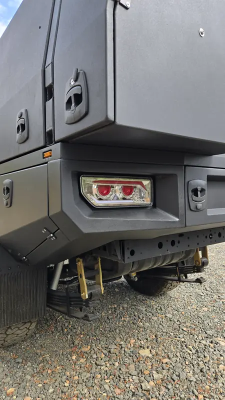 Rear of an All In 4x4 canopy showing lights and gullwing door