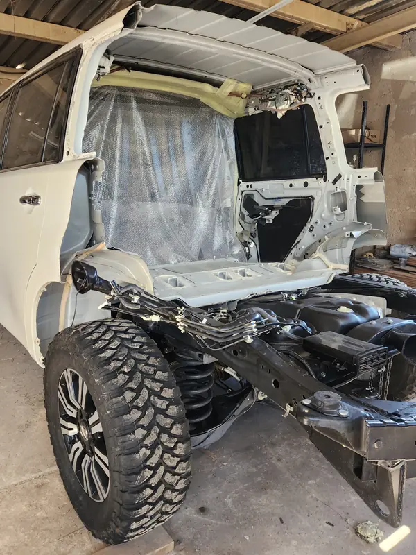 Stripped chassis and cab during a vehicle conversion