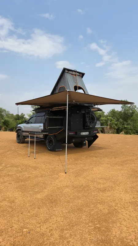Roof top tent and awning set up in the bush