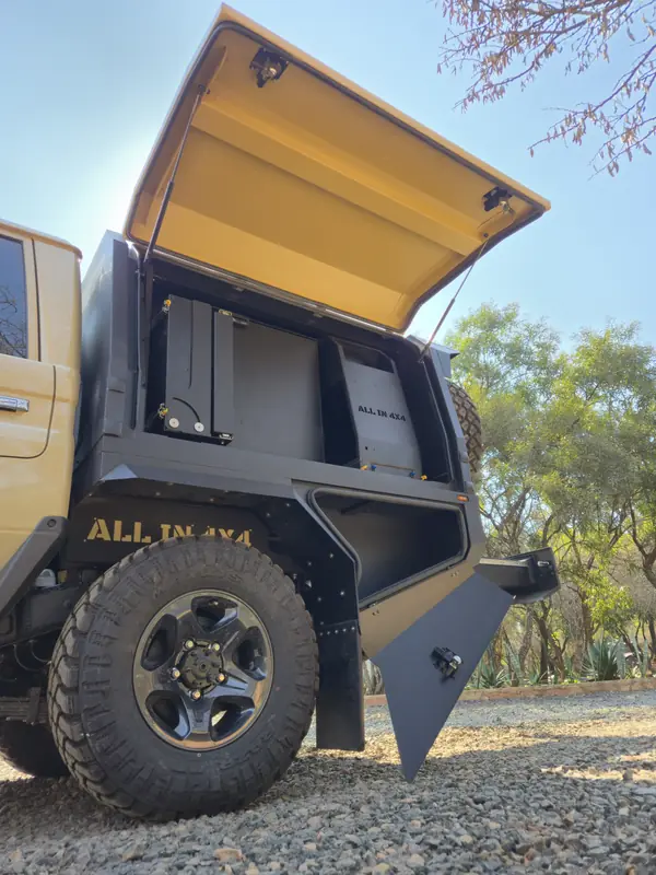 Gullwing door open on a tan All In 4x4 canopy