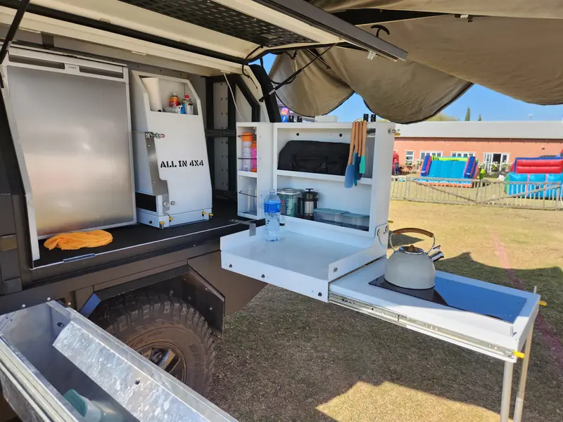 Slide out kitchen with sink built into a canopy