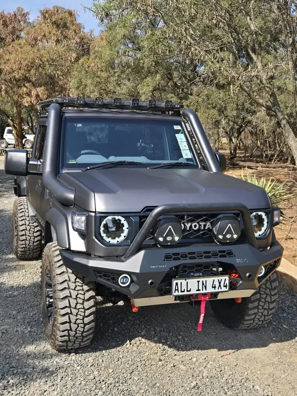 Grey Land Cruiser 79 with an All In 4x4 snorkel