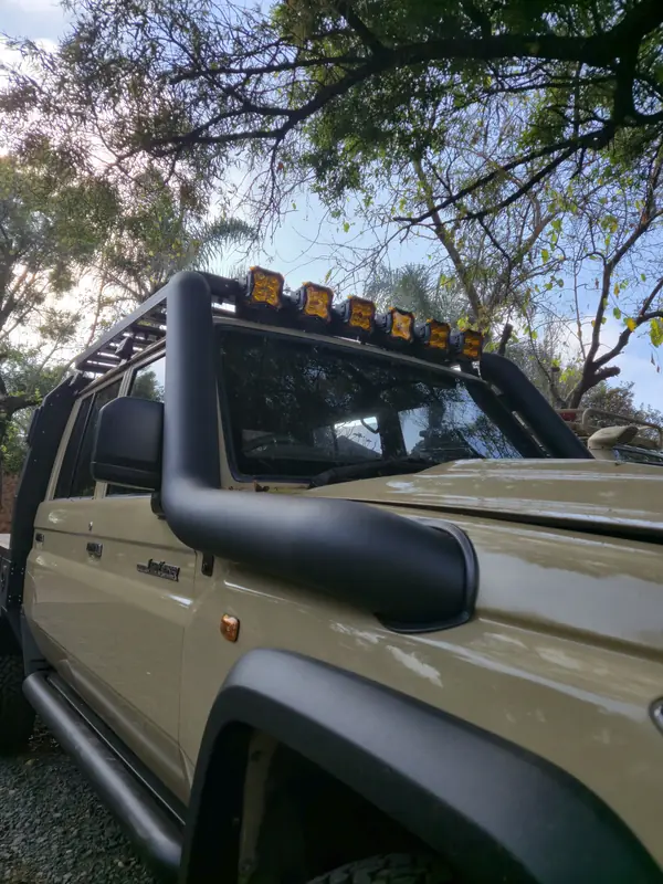 Stainless steel snorkel on an olive Land Cruiser 79
