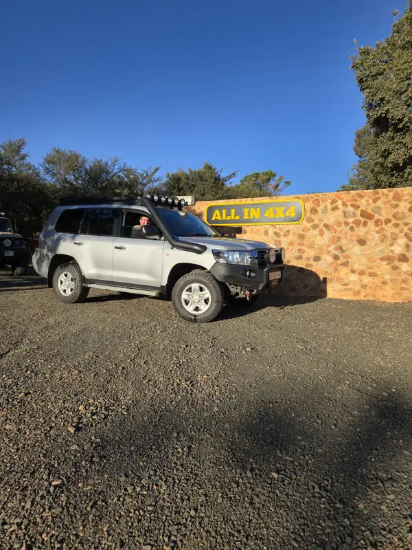 White Land Cruiser with a stainless steel snorkel